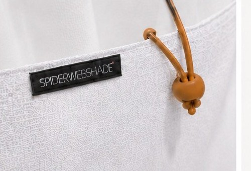 Close detail of the caramel bungee toggle and stitched canvas